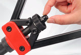 Hand changing the threaded setting part on a red DZT head