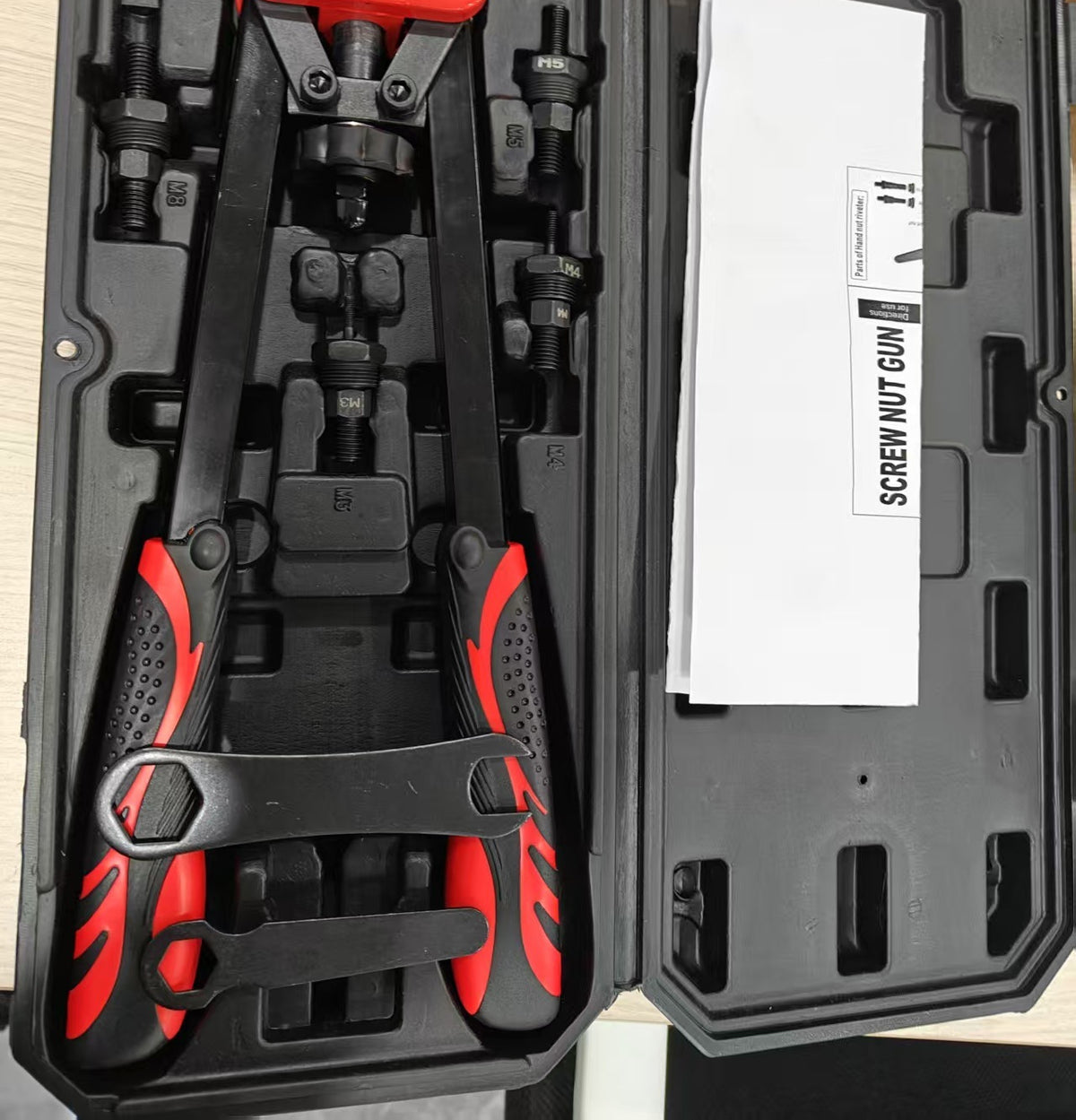 D02460 black case with tool, setting parts and supplied nut assortment