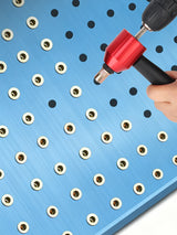 DZT adapter used with a drill at a perforated demonstration panel