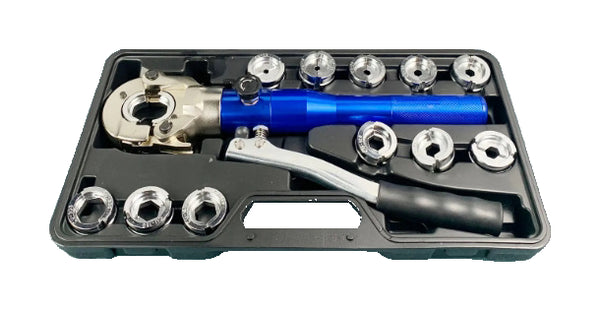 The gallery shows the actual blue tool and assorted catalog dies in the lower black carrying tray on pure white. It illustrates the catalog hardware; the order contains only the selected tool and matching package, not every die shown.