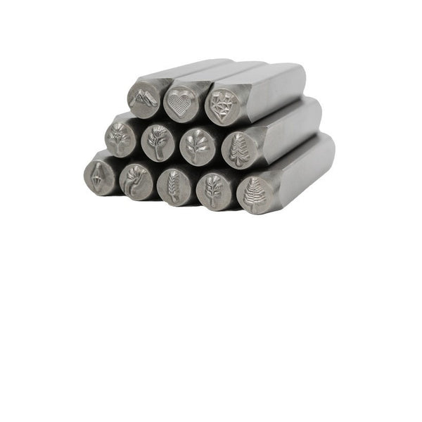 Twelve decorative steel stamping punches with floral and geometric pattern faces