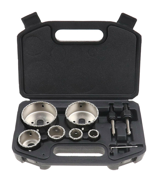 Open black case with six silver carbide hole saws, two connecting arbors and hex key