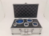 Five blue cutters seated in the open foam-lined case.