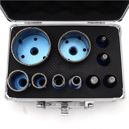 Top-down view of the ten blue diamond core cutters arranged in the open aluminum case.